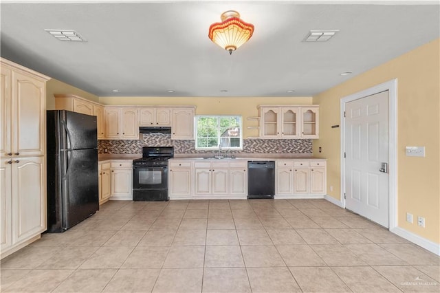 3206 Marion Ct, Harlingen, TX 78550 - kitchen featuring black appliances, tasteful backsplash, light tile patterned floors, under cabinet range hood, and cream cabinets