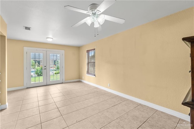 3206 Marion Ct, Harlingen, TX 78550 - unfurnished room featuring french doors, ceiling fan, and light tile patterned floors