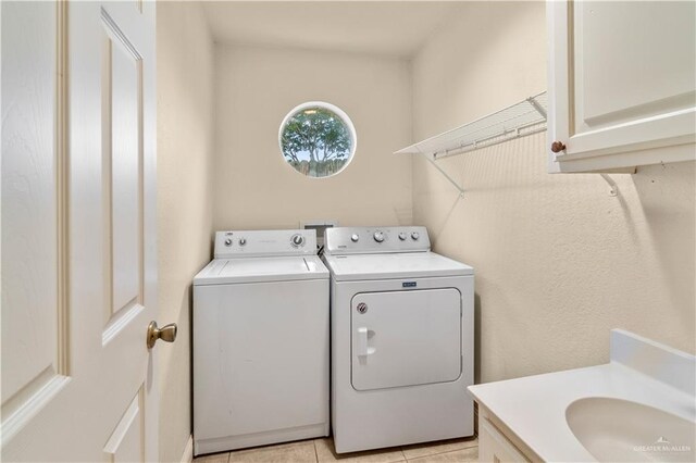 3206 Marion Ct, Harlingen, TX 78550 - washroom featuring washing machine and clothes dryer and cabinet space