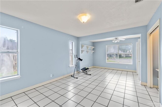 3206 Marion Ct, Harlingen, TX 78550 - workout area featuring ceiling fan and light tile patterned floors