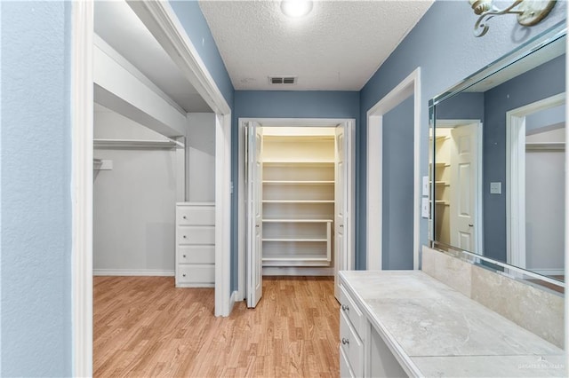 3206 Marion Ct, Harlingen, TX 78550 - walk in closet with light wood-type flooring