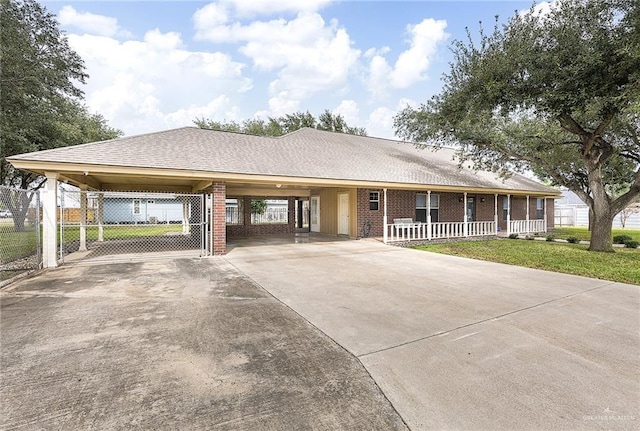 view of front of home featuring a carport and a porch