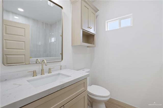 905 E 38th St E, San Juan, TX 78589 - full bathroom featuring toilet, vanity, and a shower