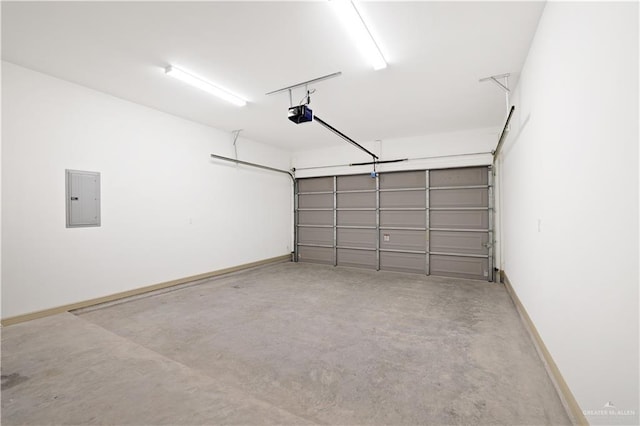 905 E 38th St E, San Juan, TX 78589 - garage with electric panel, a garage door opener, and baseboards