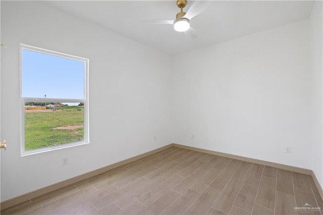 905 E 38th St E, San Juan, TX 78589 - spare room with light wood-style flooring, baseboards, and ceiling fan