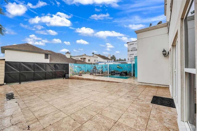 view of patio with a fenced in pool and a fenced backyard