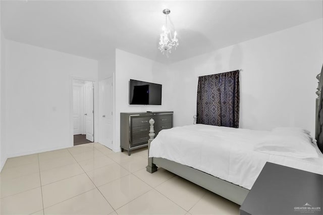tiled bedroom with baseboards and a notable chandelier