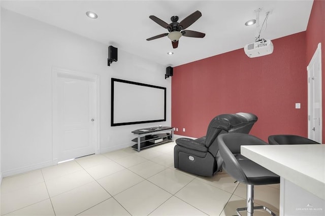 cinema room featuring light tile patterned flooring, baseboards, a ceiling fan, and recessed lighting