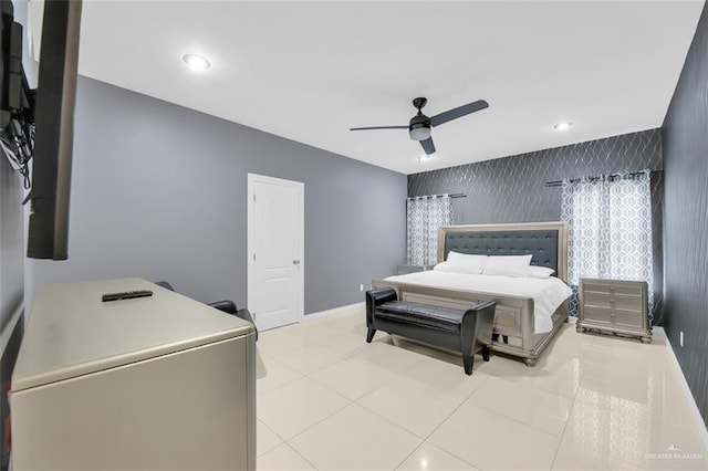 bedroom featuring recessed lighting, baseboards, ceiling fan, and an accent wall