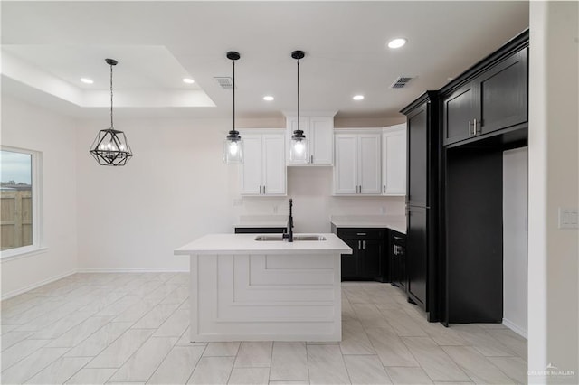 328 N Leon Ave, Elsa, TX 78543 - kitchen with a sink, recessed lighting, dark cabinets, baseboards, and light countertops