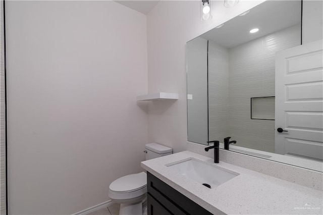328 N Leon Ave, Elsa, TX 78543 - bathroom featuring toilet, vanity, and tile patterned flooring