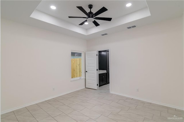 328 N Leon Ave, Elsa, TX 78543 - empty room featuring ceiling fan, a raised ceiling, recessed lighting, and baseboards