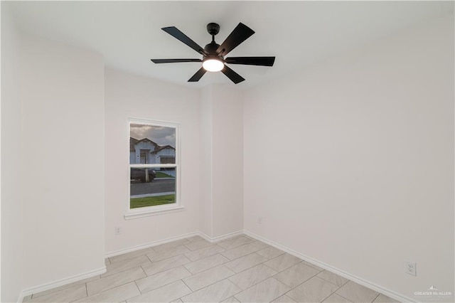 328 N Leon Ave, Elsa, TX 78543 - unfurnished room with ceiling fan and baseboards