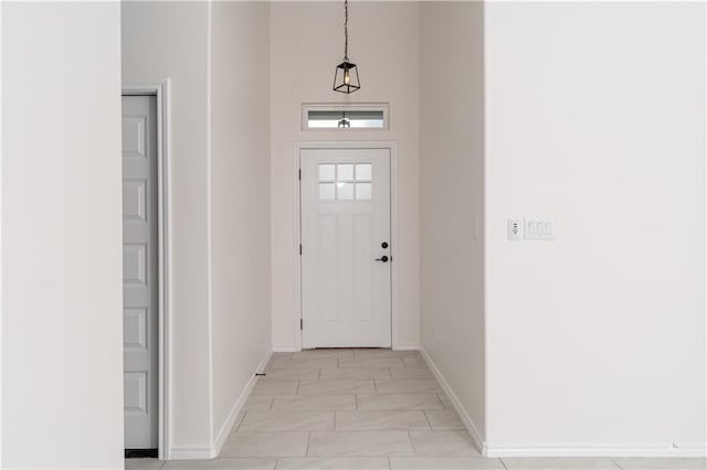 328 N Leon Ave, Elsa, TX 78543 - entrance foyer with baseboards and light marble finish flooring