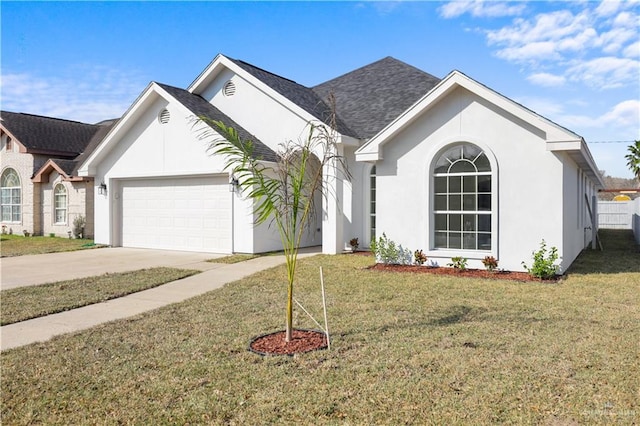 ranch-style home with a garage and a front lawn