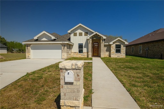 view of front of home featuring a front yard, an attached garage, board and batten siding, and driveway