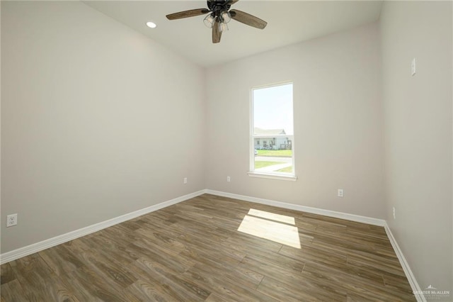 unfurnished room with recessed lighting, baseboards, wood finished floors, and ceiling fan