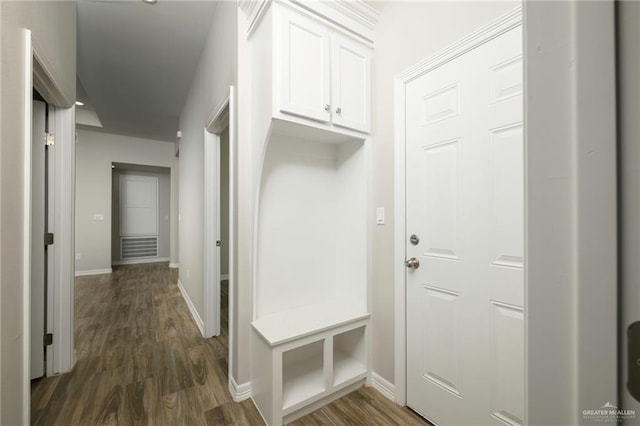 mudroom with baseboards and dark wood-style flooring