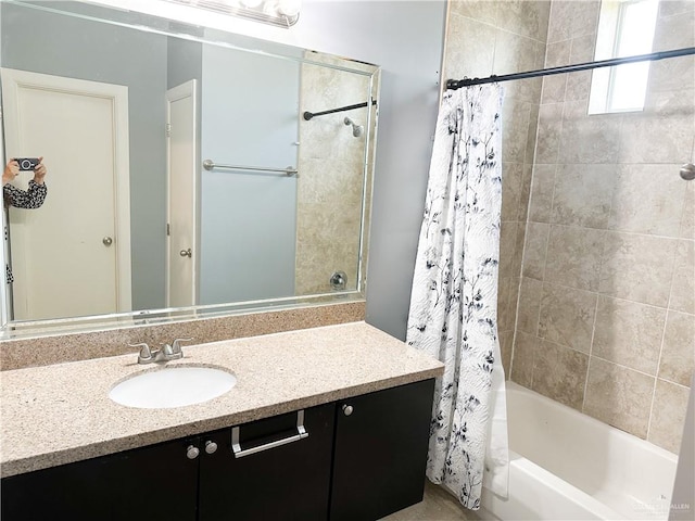 bathroom with shower / bath combo and vanity