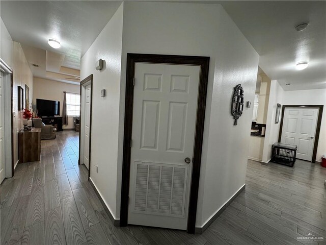 hallway featuring dark hardwood / wood-style floors