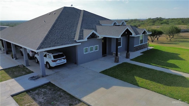 view of home's exterior with a yard and a carport