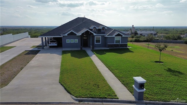 view of front of property with a carport and a front yard