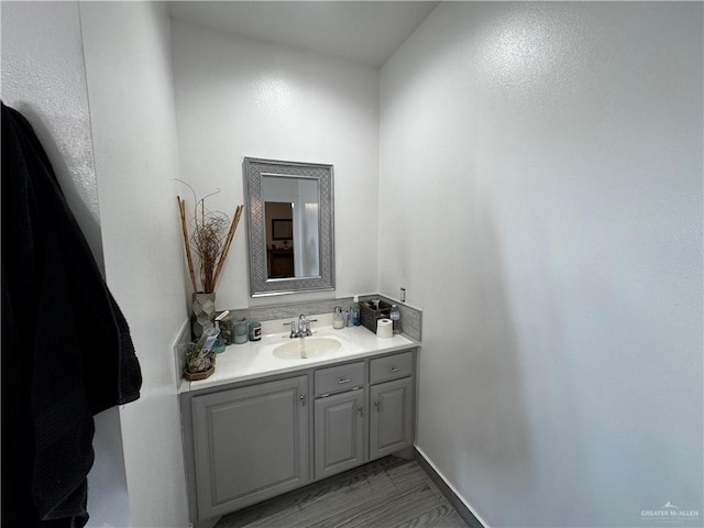 bathroom featuring hardwood / wood-style floors and vanity