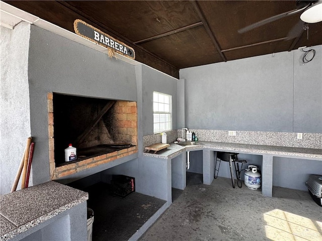 view of patio / terrace featuring ceiling fan and sink