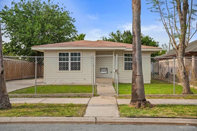 bungalow-style house with a gate, a shingled roof, and fence private yard