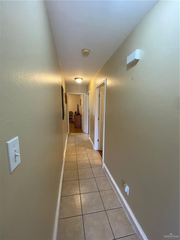 1903 E Llano Grande St, Weslaco, TX 78596 - corridor featuring light tile patterned floors and baseboards
