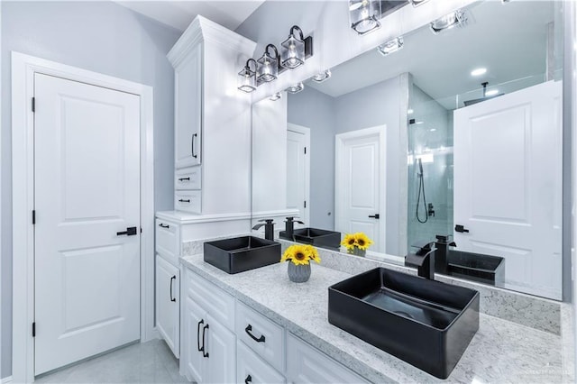 bathroom with vanity and walk in shower