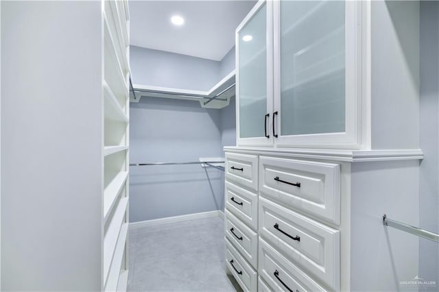 walk in closet featuring light tile patterned floors