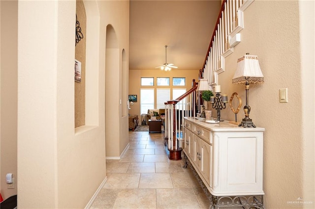 corridor featuring light tile patterned floors