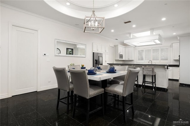 101 San Jacinto St, Mission, TX 78572 - dining room with granite floors, a chandelier, recessed lighting, a raised ceiling, and crown molding