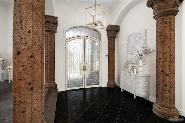 101 San Jacinto St, Mission, TX 78572 - entrance foyer with granite floors, french doors, arched walkways, decorative columns, and crown molding