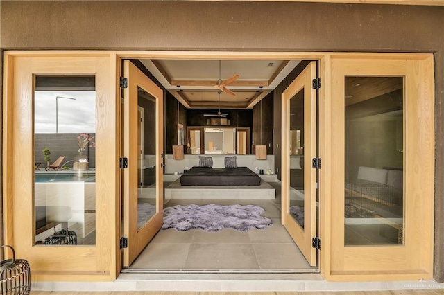 doorway with french doors and light tile patterned floors