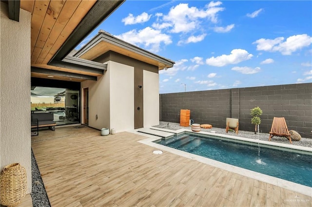 view of pool with pool water feature