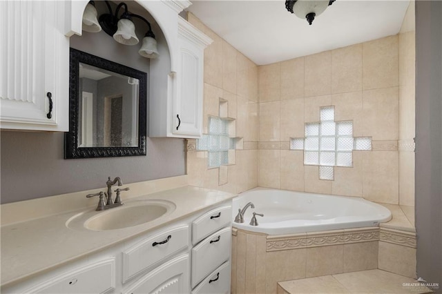 bathroom featuring a garden tub and vanity