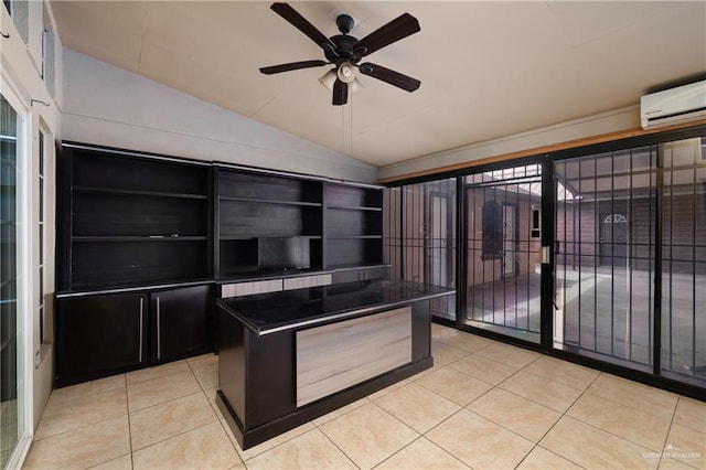 kitchen featuring a wall unit AC, lofted ceiling, dark countertops, light tile patterned flooring, and ceiling fan