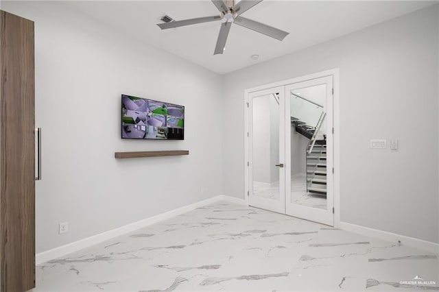 unfurnished bedroom featuring marble finish floor, baseboards, french doors, and visible vents