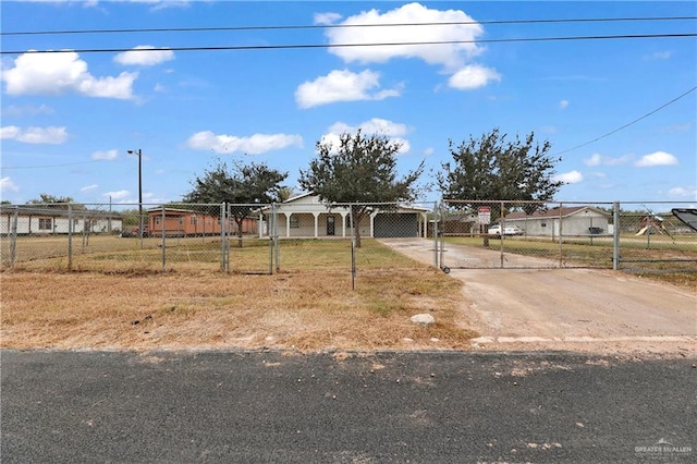 1619 Beech Ave, Mercedes, TX 78570 - view of front of property featuring concrete driveway and a gate