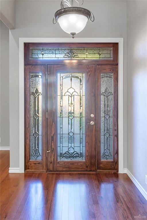 foyer featuring dark hardwood / wood-style floors and french doors