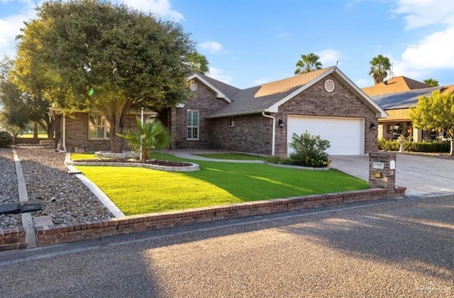 ranch-style home featuring a front yard and a garage