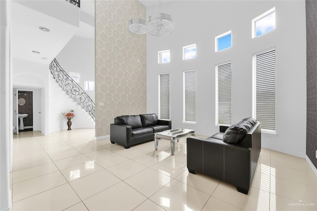 living room featuring light tile patterned floors and a high ceiling