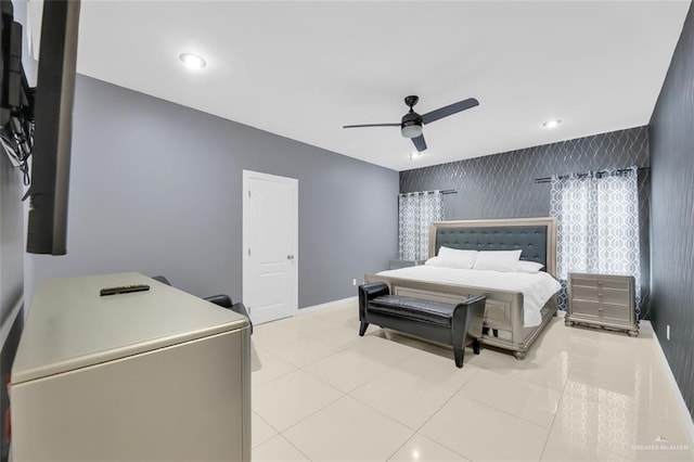 bedroom with ceiling fan and light tile patterned floors