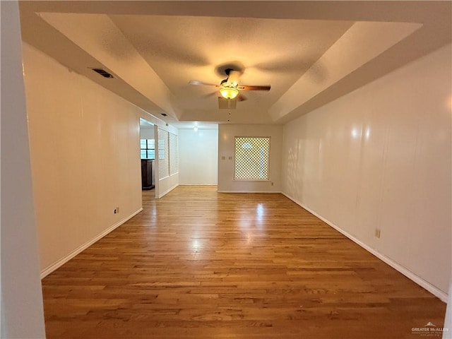 spare room featuring ceiling fan and hardwood / wood-style floors