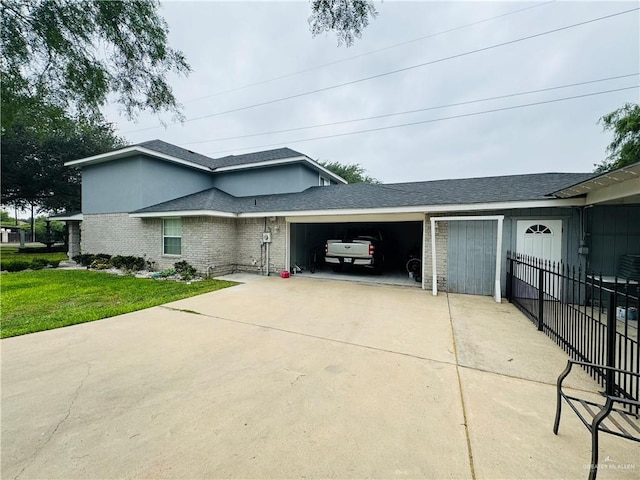 view of front of property with a garage and a front yard