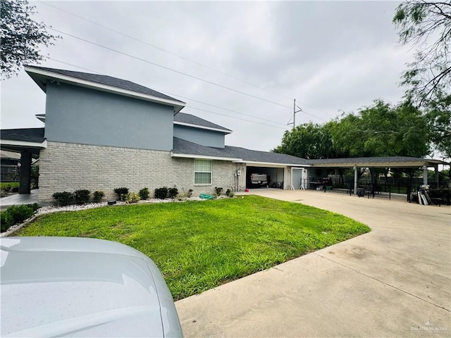 view of side of property with a yard and a carport