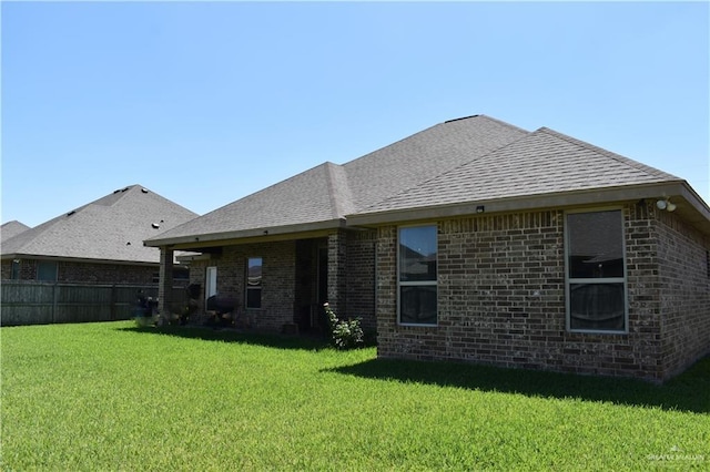 10210 N 28th Ln, Mcallen, TX 78504 - rear view of house with roof with shingles and brick siding