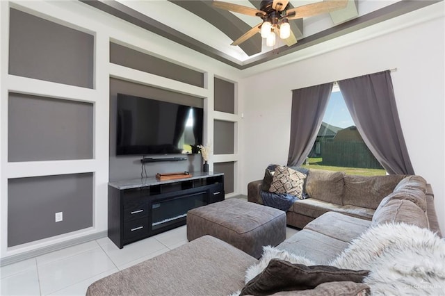 tiled living room with built in shelves and ceiling fan